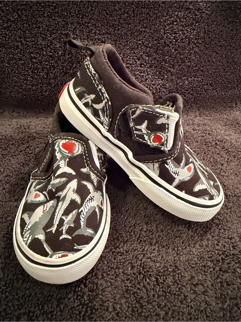 Vans Kids Slip-On Sneakers in Black, White & Red Shark Pattern